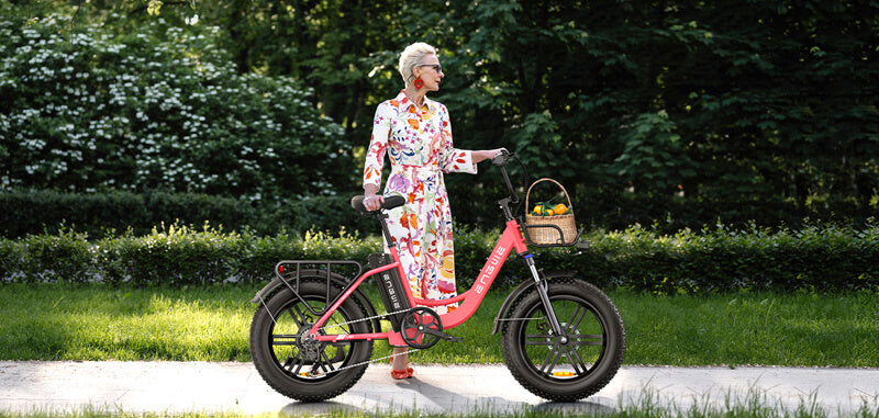 a woman stands near  engwe l20 e-bike