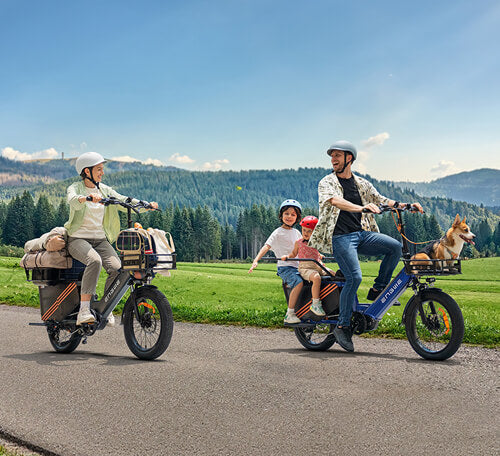 a woman riding a le20 with belongings, and a man riding a le20 with children and dog