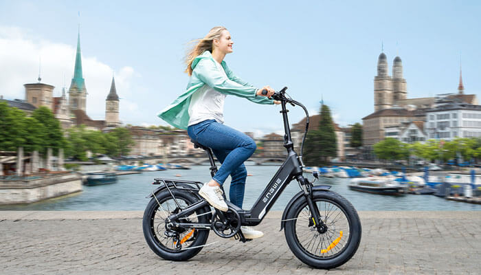 a woman riding a compact E-Bike with full suspension engwe l20 3.0 Boost 