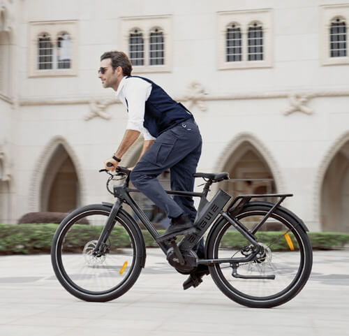 a man riding an engwe p275 pro urban e-bike on the road