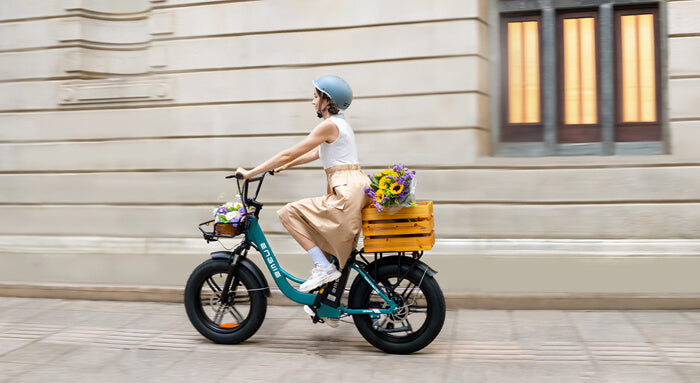 a woman riding an engwe l20 boost torque sensing ebike on the road