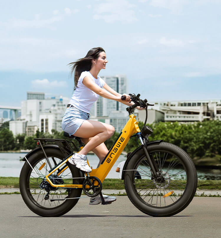 a girl riding an urban e bike on the city road