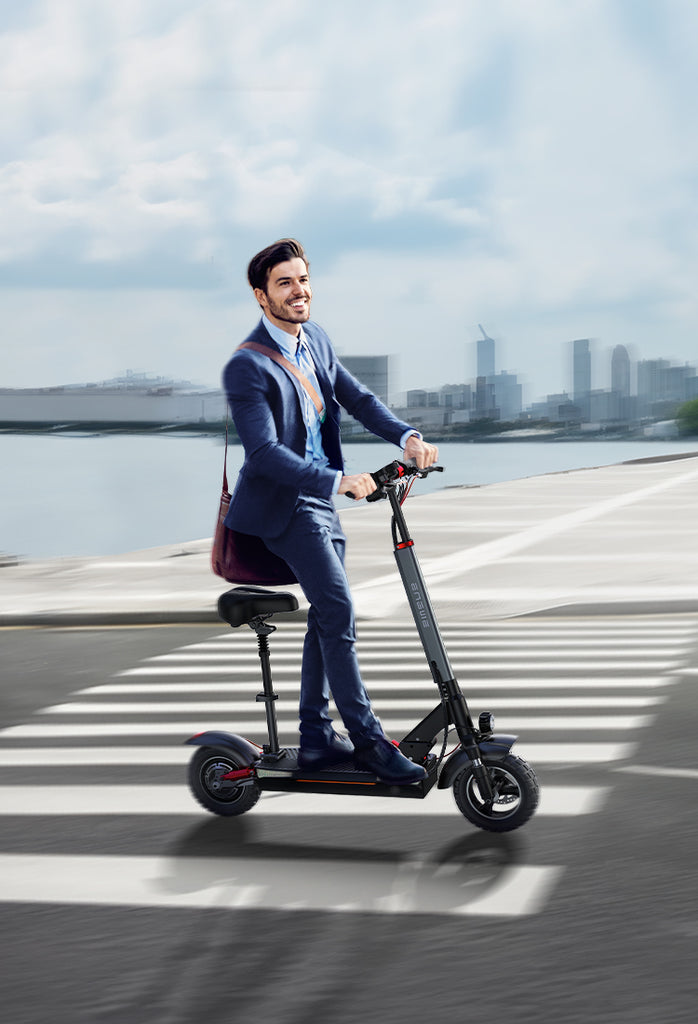 A male office worker in a suit rides an engwe y600 e-scooter