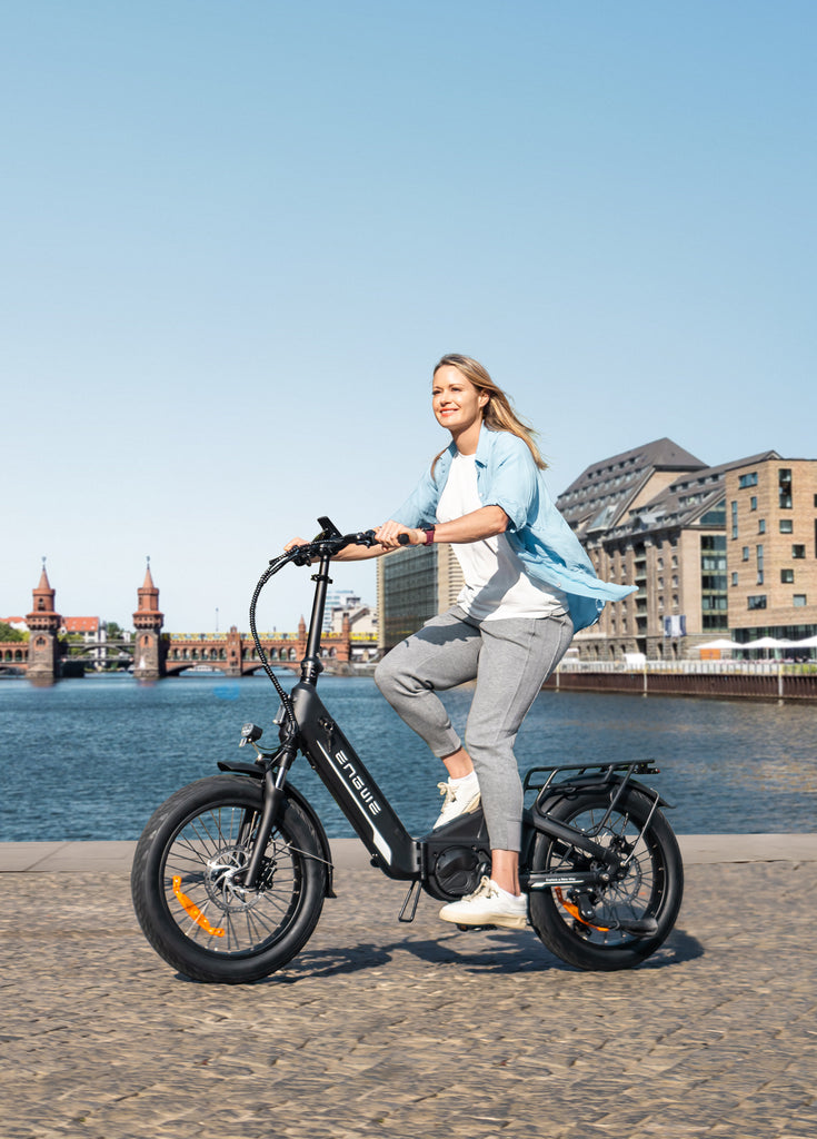 a woman riding on black ENGWE L20 3.0 Pro